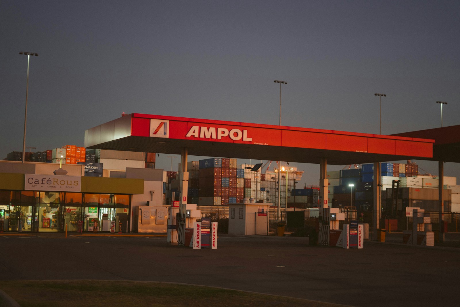 an empty gas station with a red awning