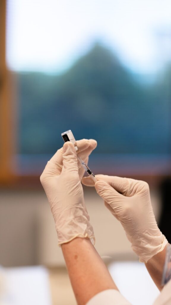 person holding black usb cable